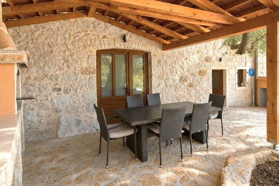 Outdoor area with seating at the stone house