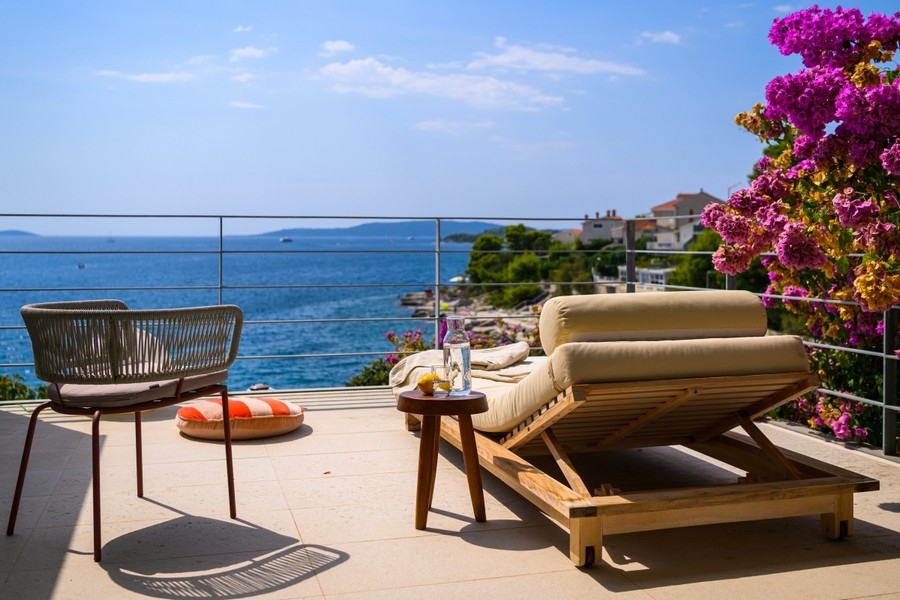 Terrace with sun loungers and sea views