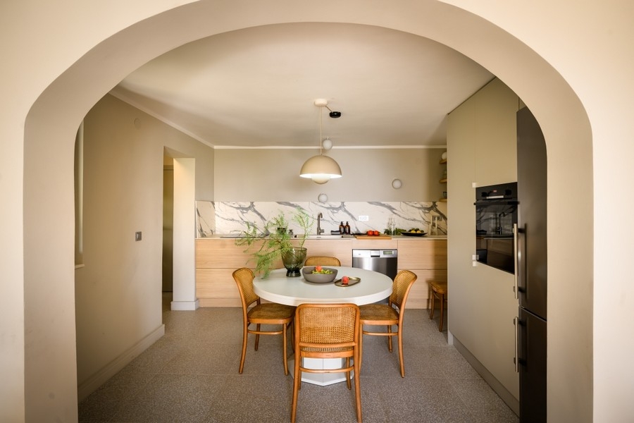 View through the archway into the kitchen-living room