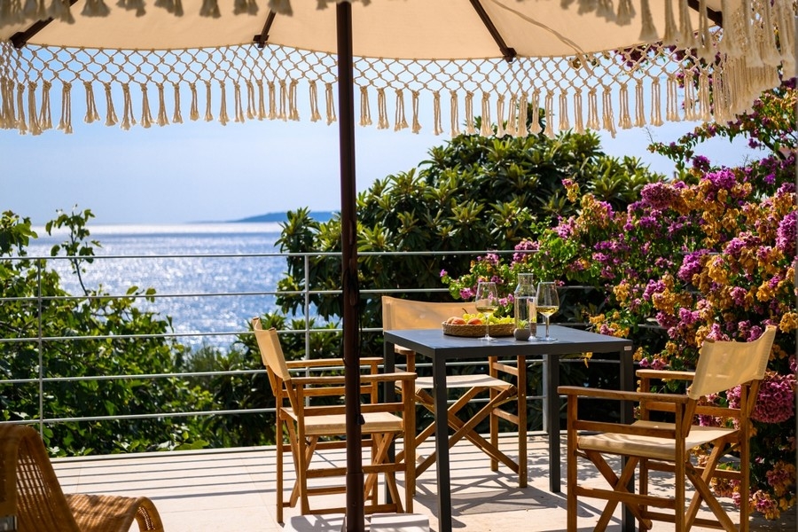 Terrace with seating and open sea views