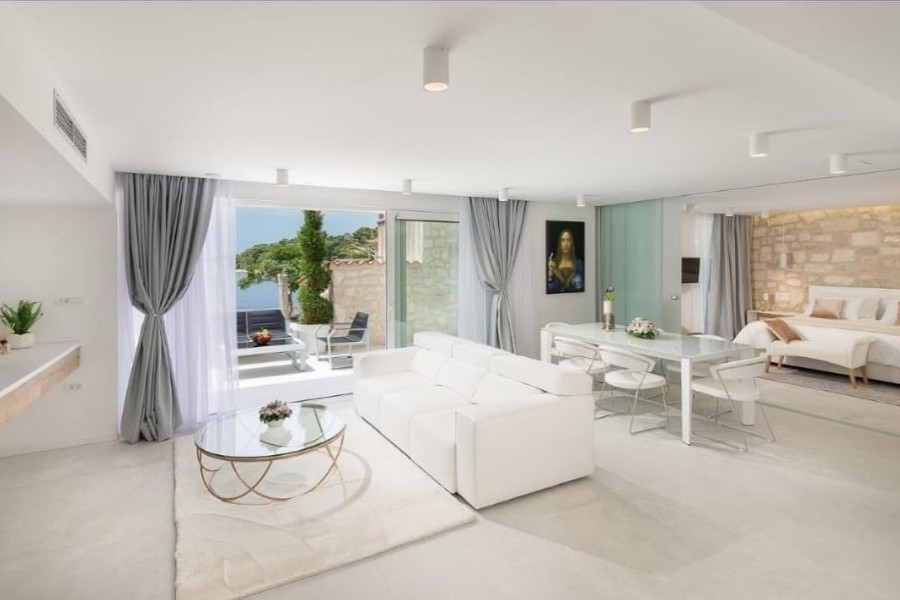 Bright living area with sofa and sea views
