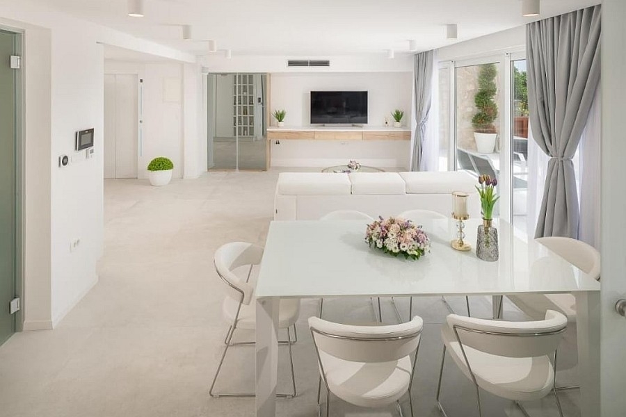 Open living area with table and television