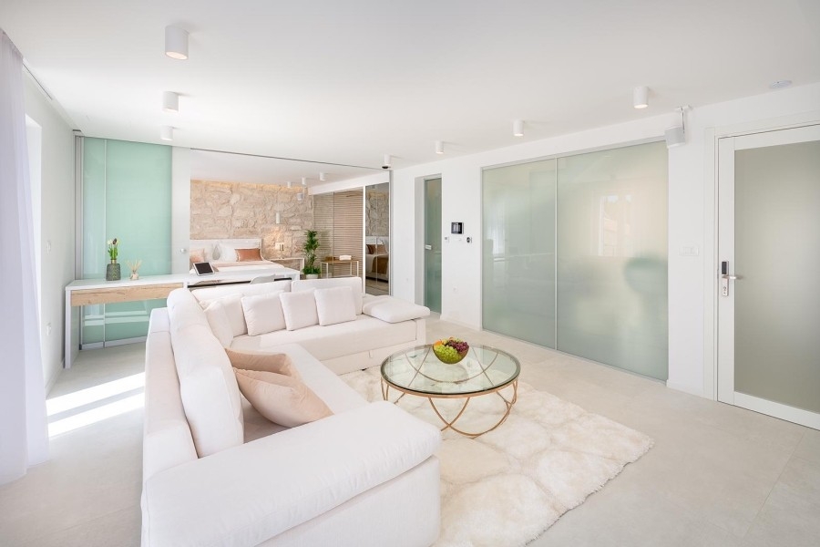 Living area with sofa and glass partition