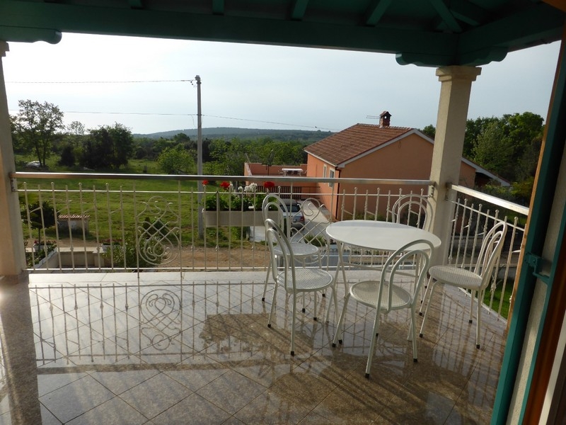 Terrace with seating and a view of the greenery