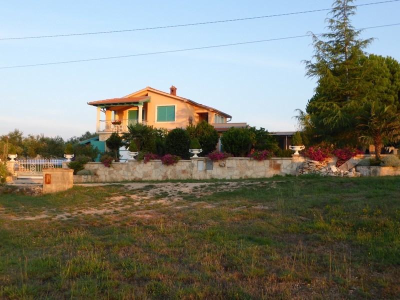House on a hillside with a Mediterranean garden