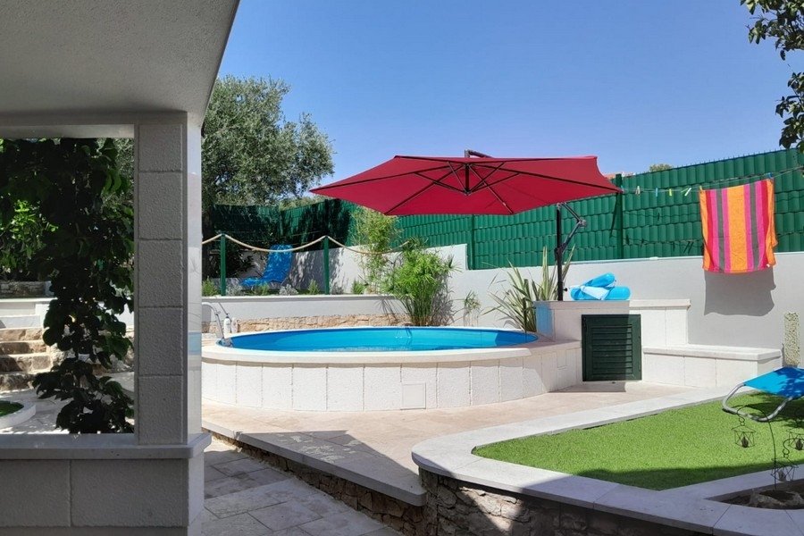 Swimming pool with covered terrace