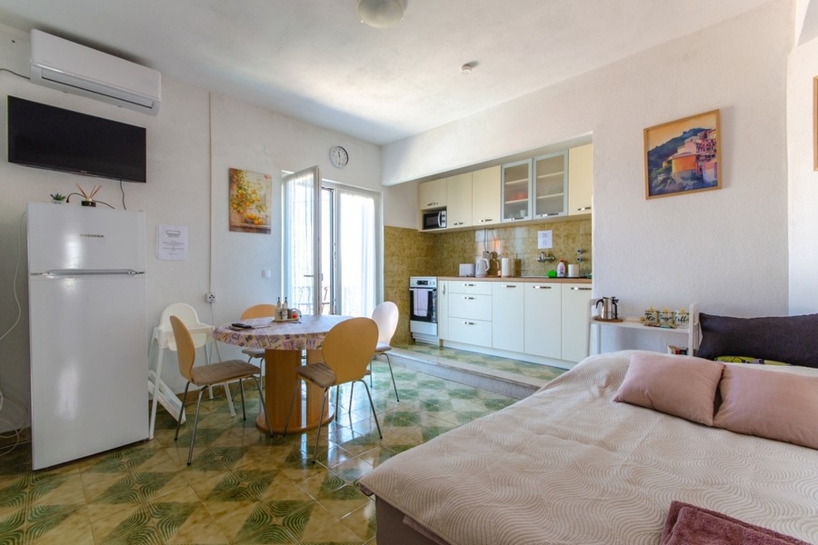 Kitchen with dining area and natural light