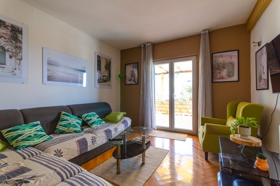 Living room with sofa and terrace access