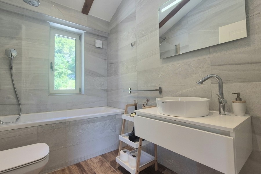 Bathroom with bathtub and vanity