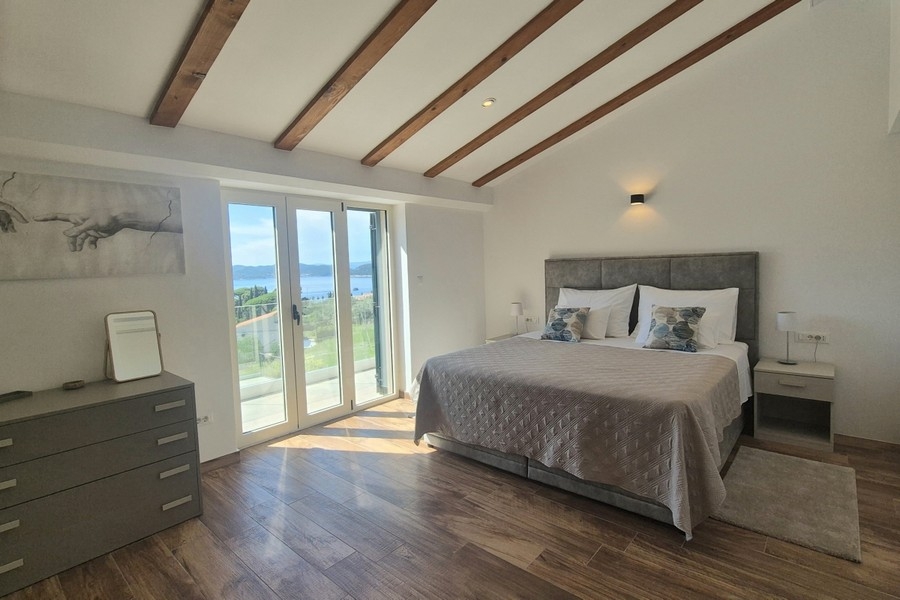 Bedroom with double bed and terrace access