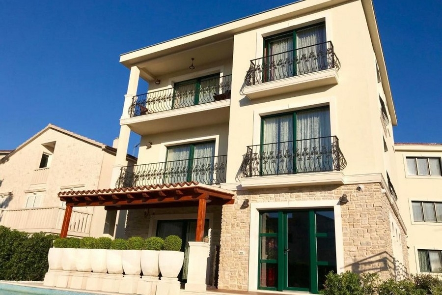 Modern villa with balconies and pergola