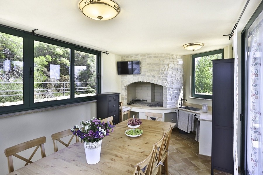 Living room with fireplace and large windows