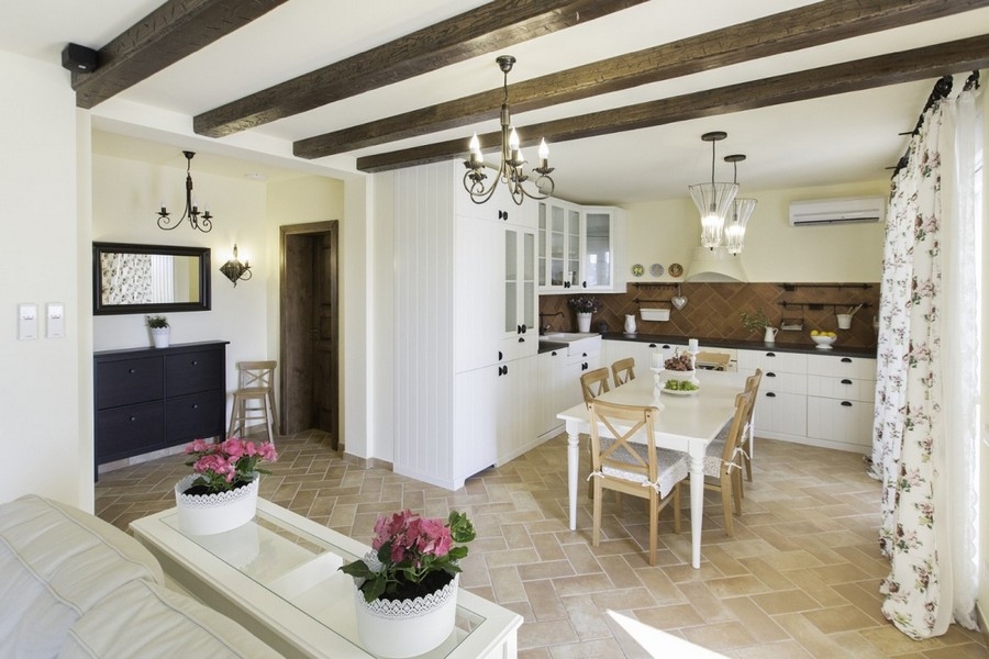 Open living area with beamed ceiling