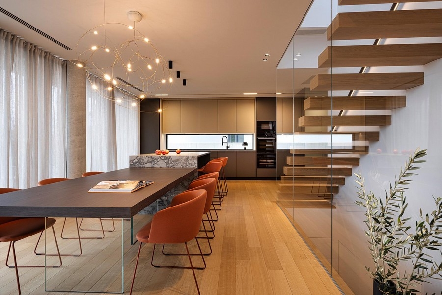 Dining area with kitchen and stairs