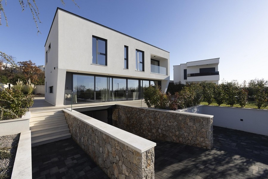 Exterior view of the villa with natural stone wall