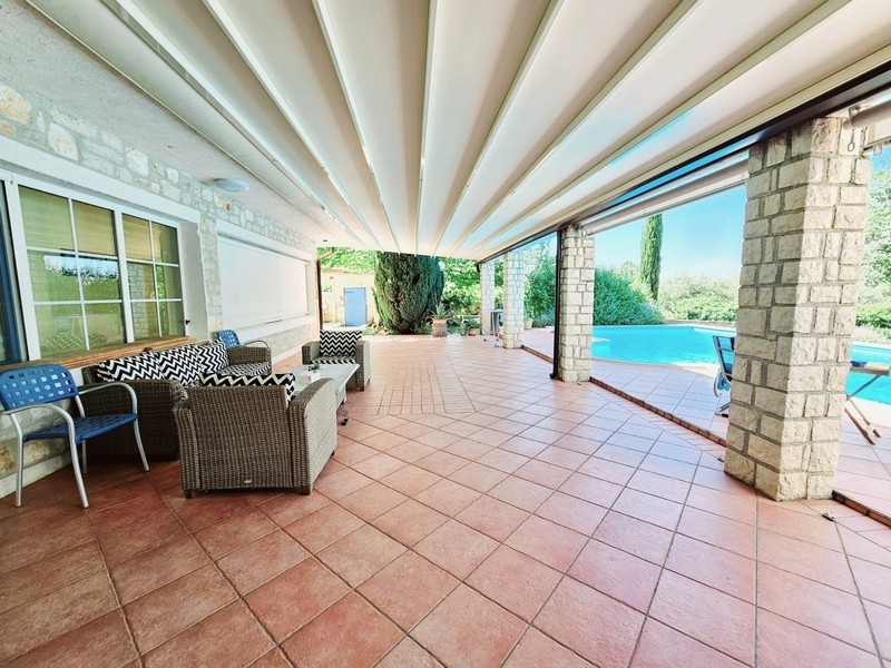 Terrace with lounge furniture and view of the pool in Croatia