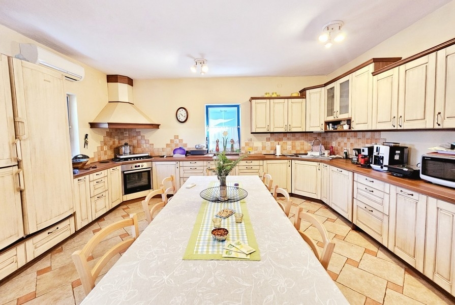 Kitchen with dining area and bright furnishings
