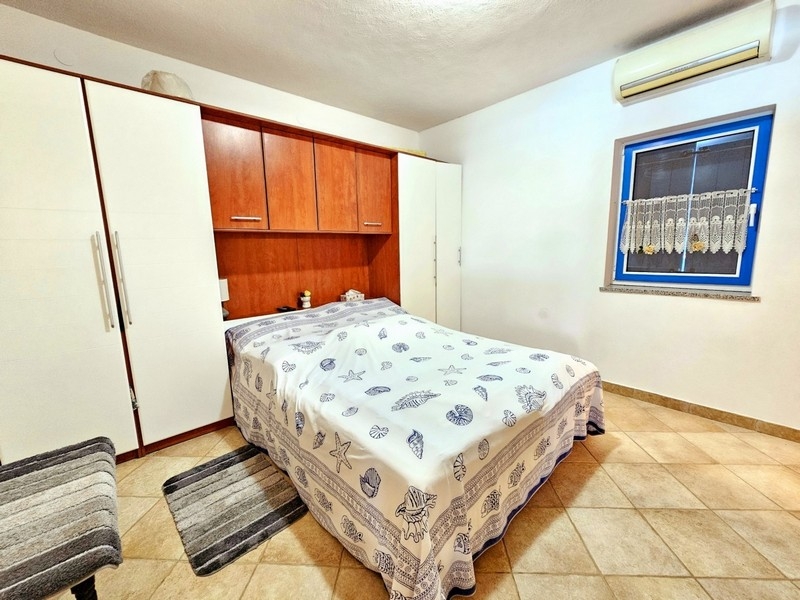 Bedroom with double bed and air conditioning