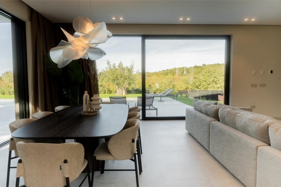Dining area with dining table and designer lamp