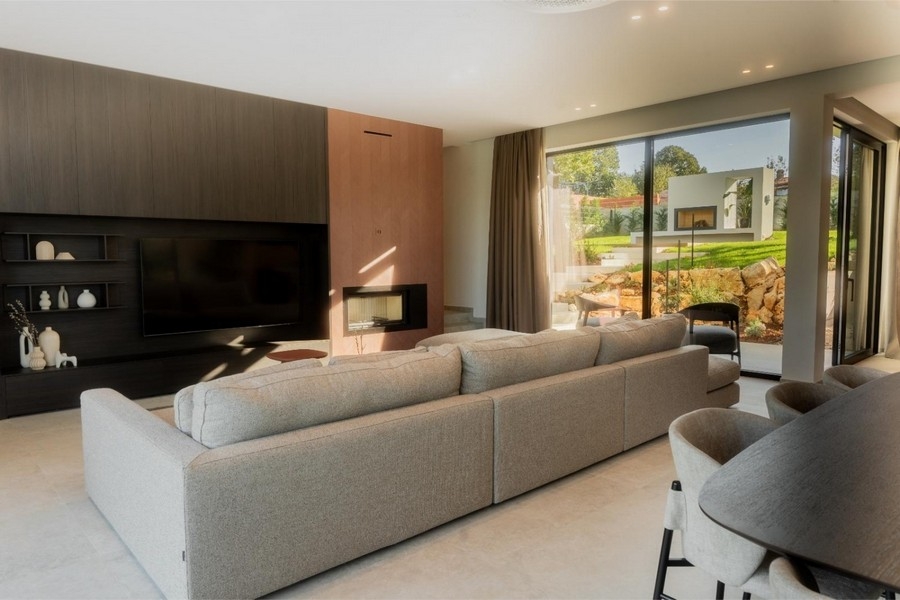 Living room with fireplace and TV wall