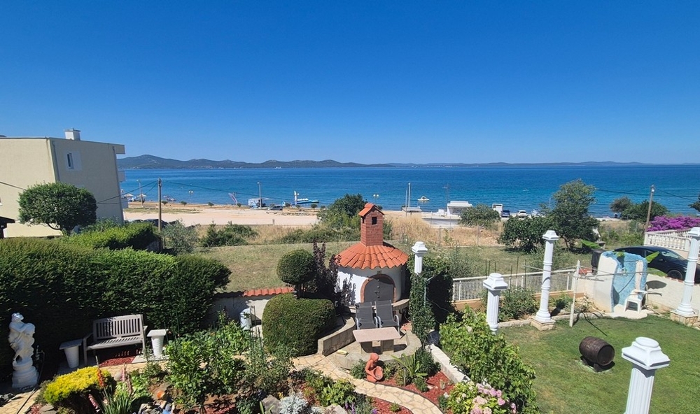 View over the garden to the beach and sea