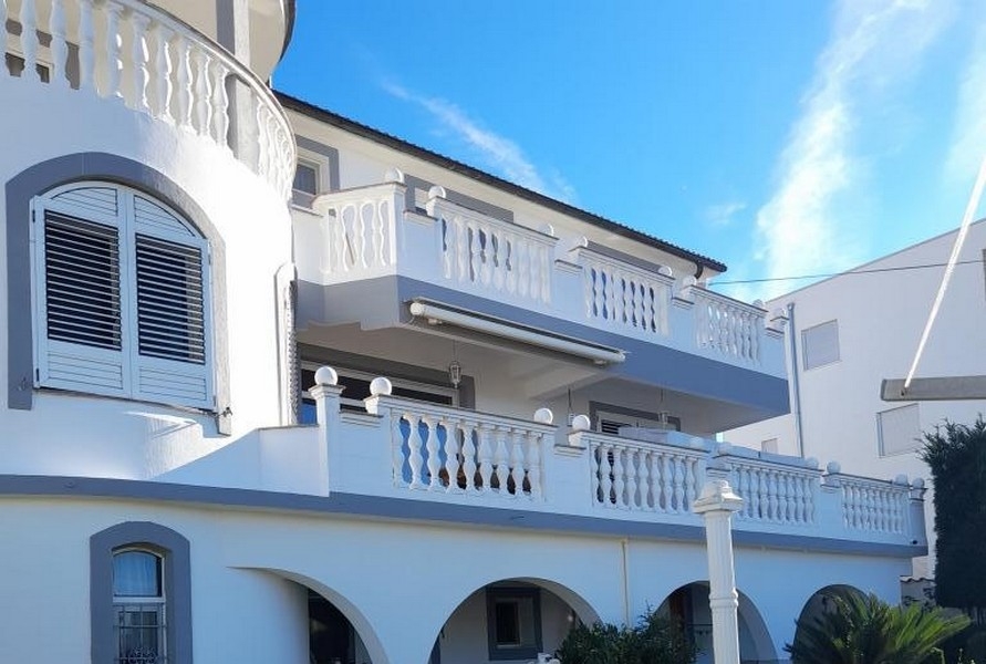 Facade with balconies and balustrades