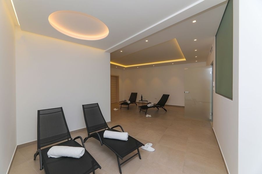 Wellness area with loungers in the villa