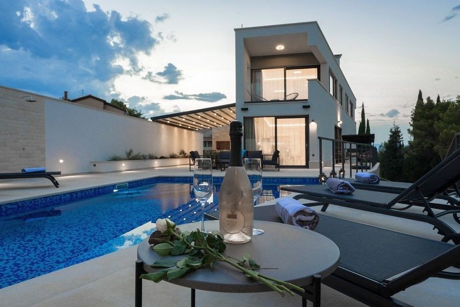 Pool terrace with sun loungers in the evening