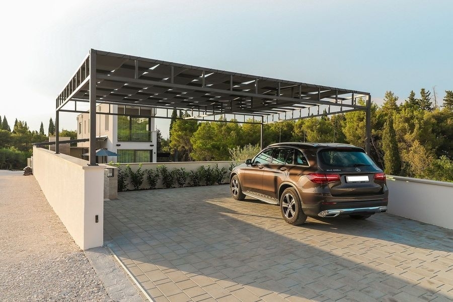 Covered parking spaces at the villa