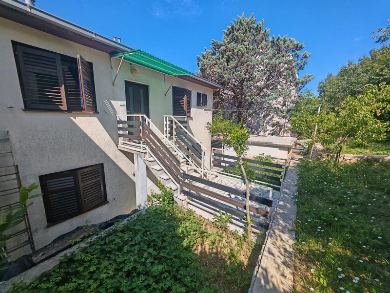 House view with external stairs and garden