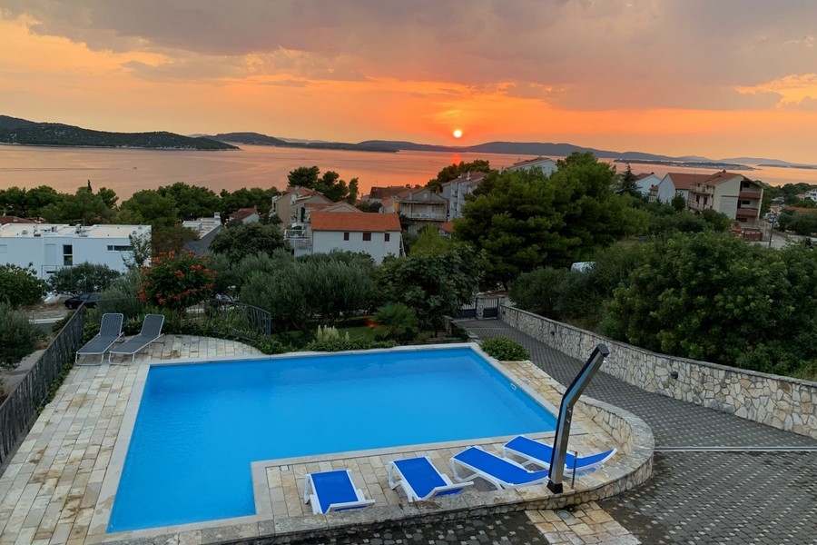 Pool with sea view at sunset in Croatia
