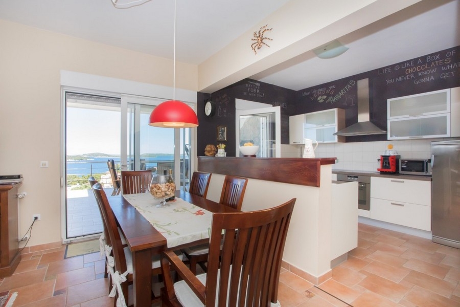 Kitchen with dining area and sea views