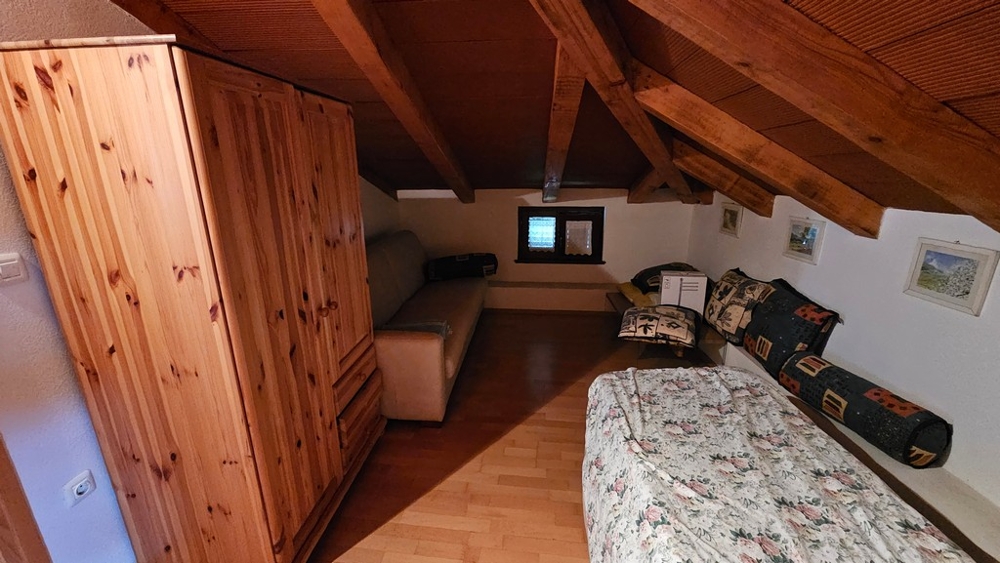 Attic room with wardrobe and sofa bed