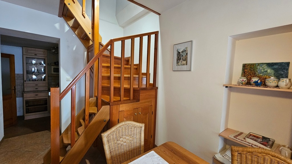 Living area with wooden stairs in Croatia