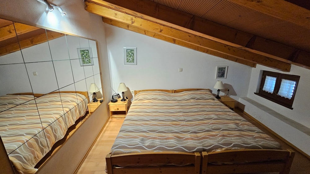 Bedroom in the attic with double bed