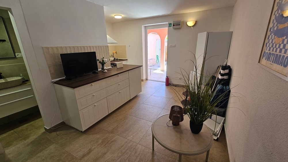 Living area with sideboard and television
