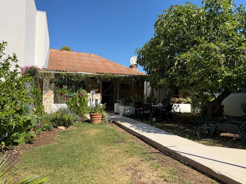 Garden with lawn and house in Croatia