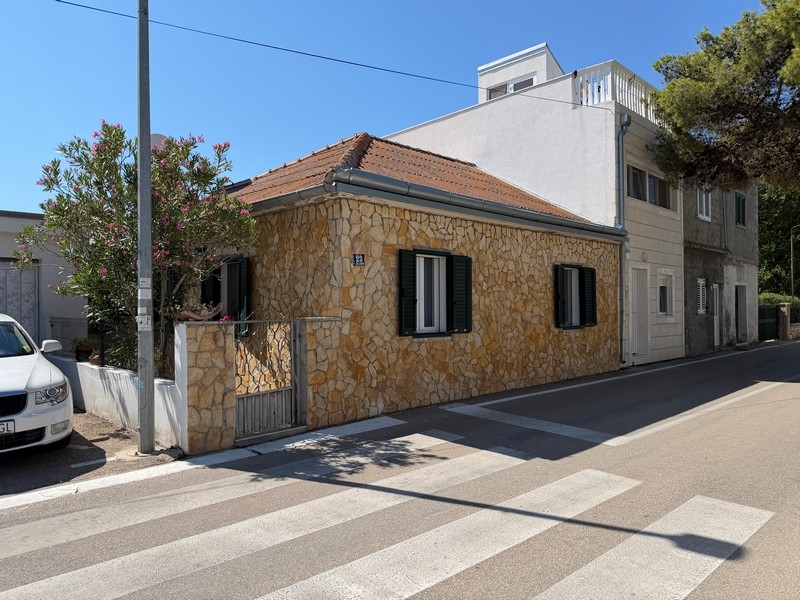Exterior view of the house with natural stone facade