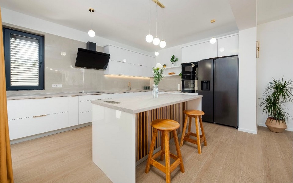 Kitchen with island and bar stools