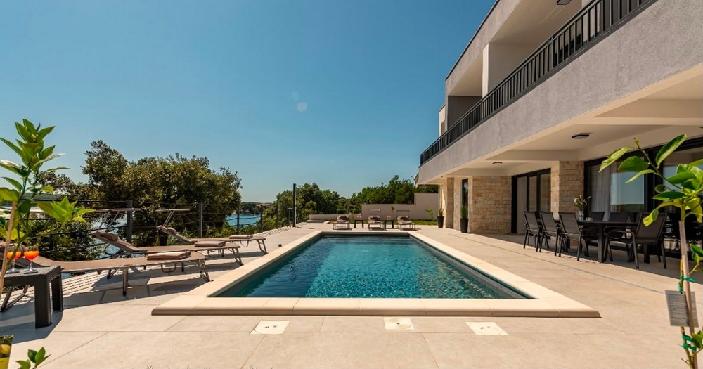 Swimming pool with terrace in front of the villa