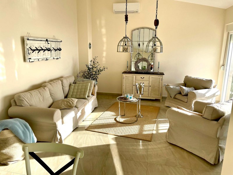 Living room with sofas and air conditioning