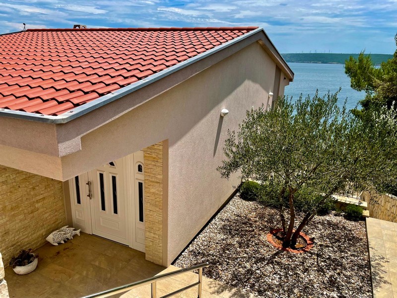 House entrance with olive tree