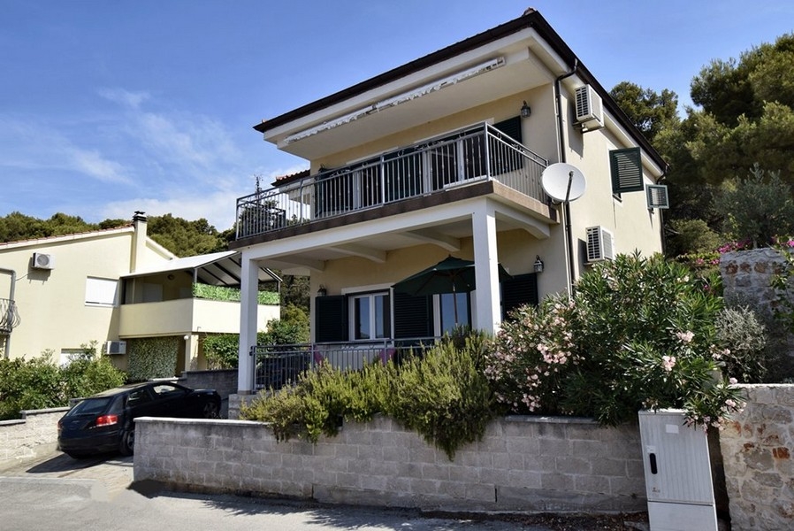 Side view of the house with garden in Tisno