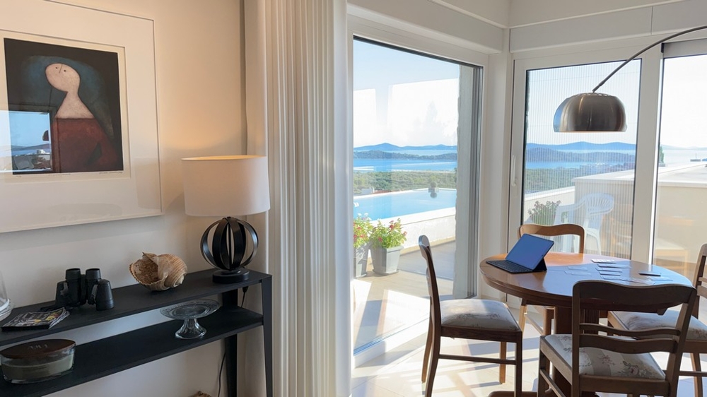 Living area with terrace access and sea views