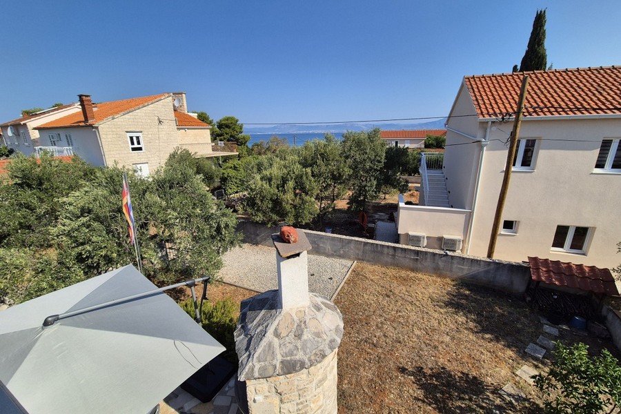 View from the upper floor across the garden to the sea