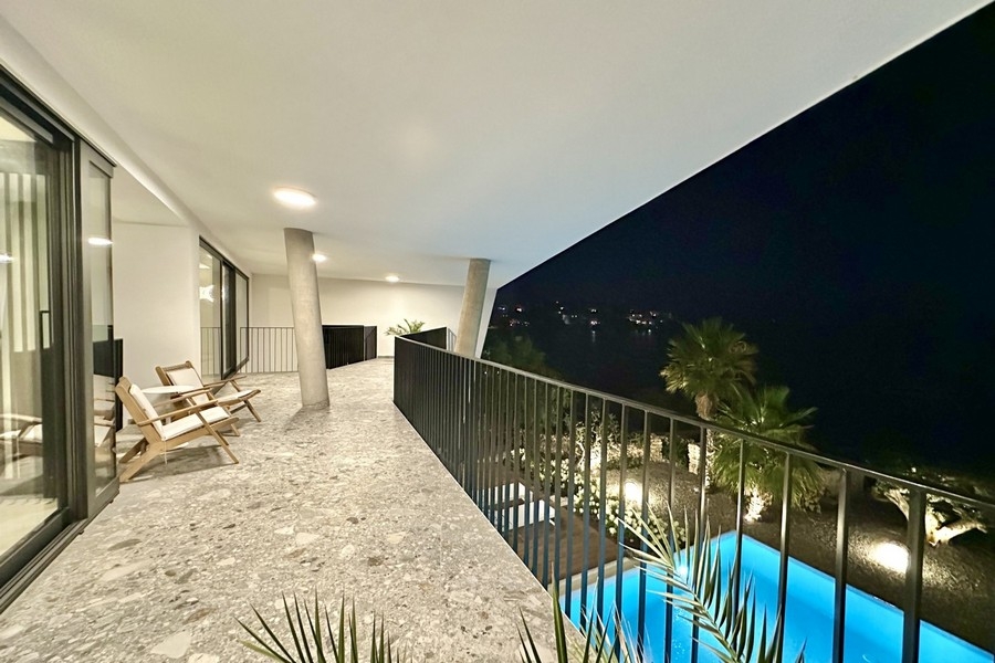 Covered terrace in the evening with a view of the bay