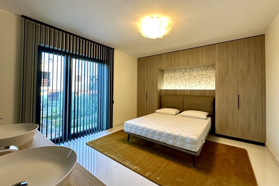 Bedroom with wooden wall and double bed