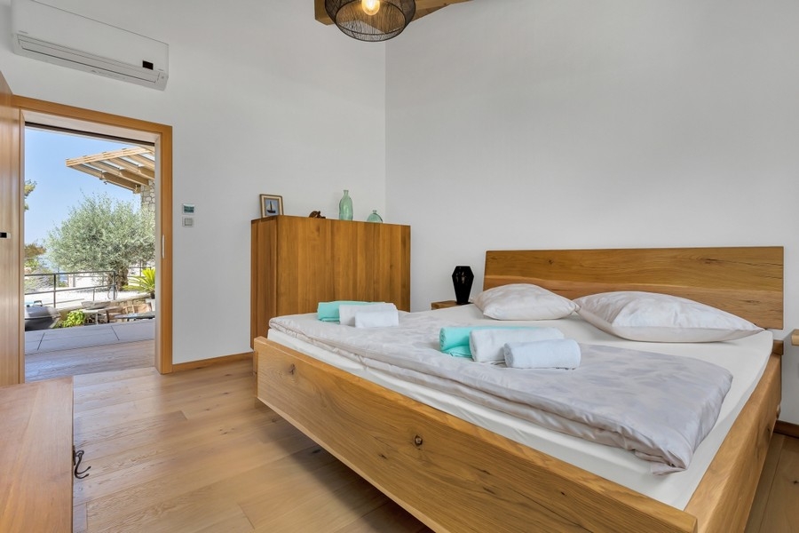 Bedroom with wooden double bed