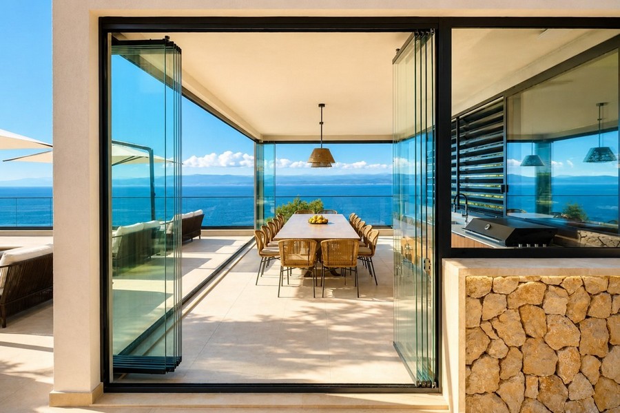 Glazed dining area with sea views