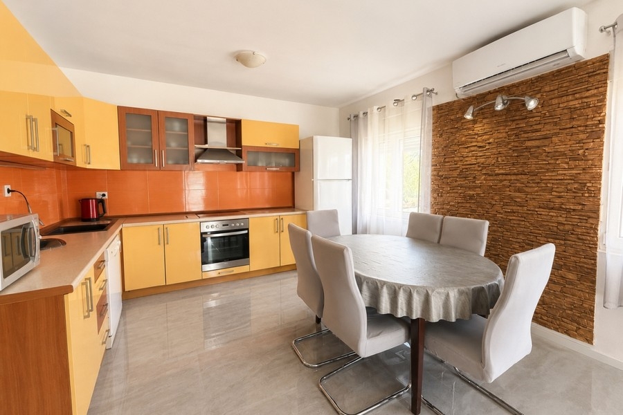 Kitchen-living room with dining area in the house in Croatia
